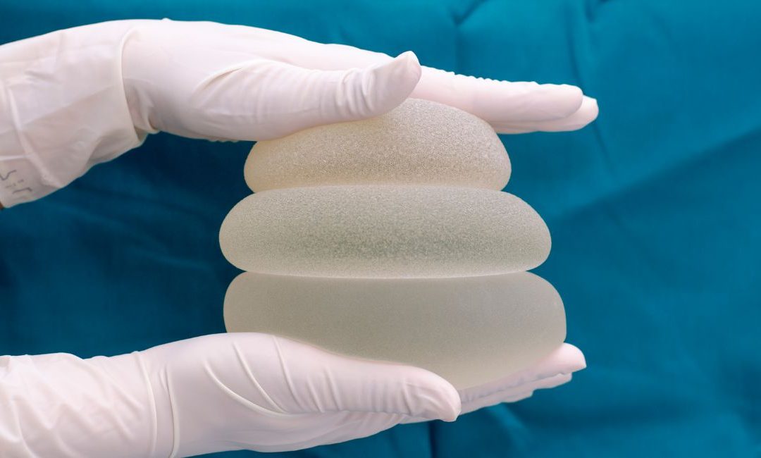 A stack of breast implants of different sizes